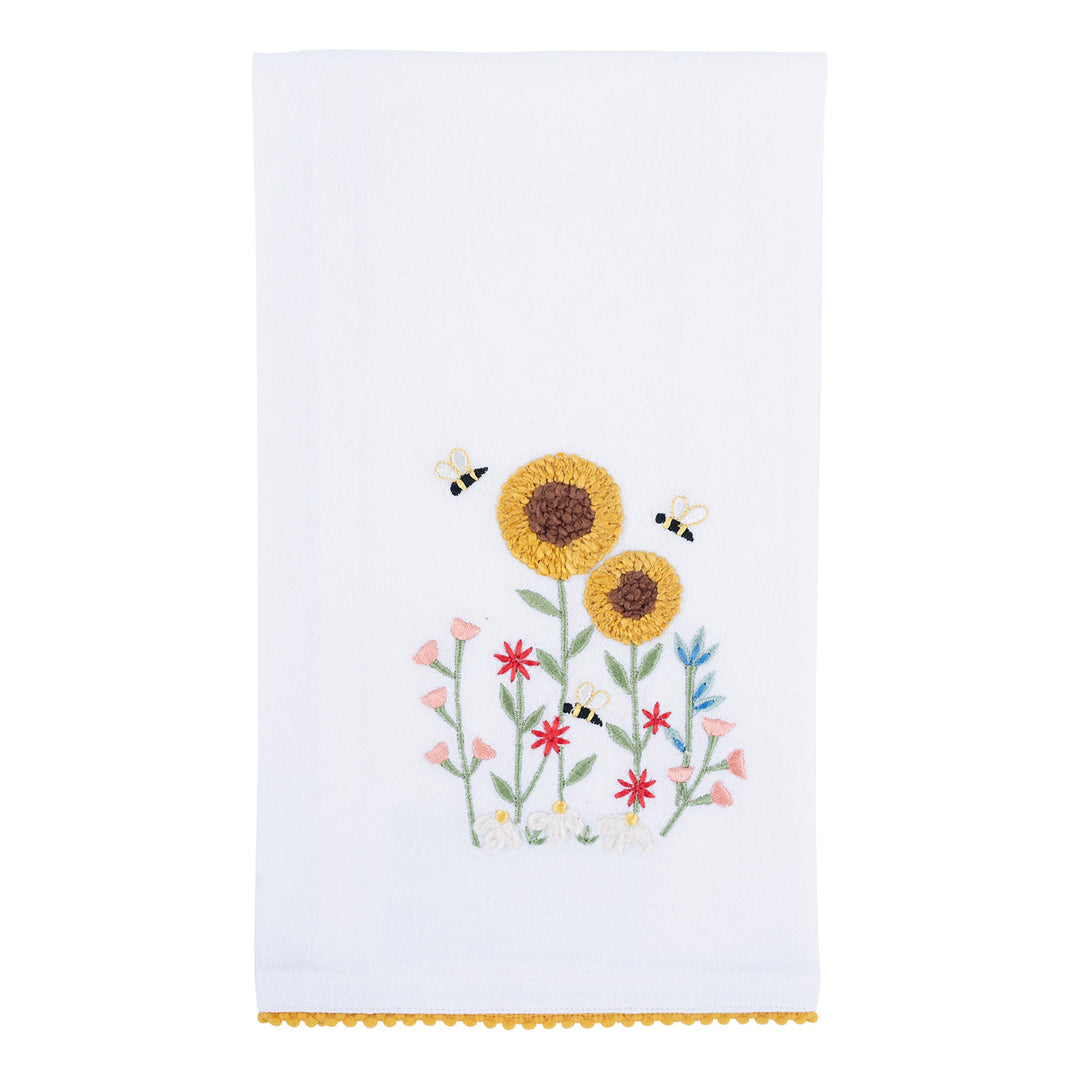 Embroidered towel with sunflowers and bees design on a white towel with ric rac trim